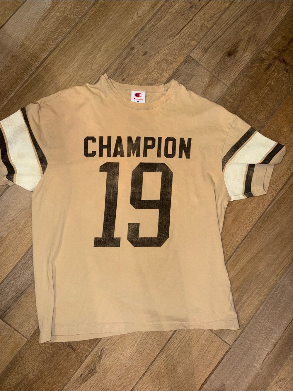 Champion Tan Tee with Black 'CHAMPION' and Number 19